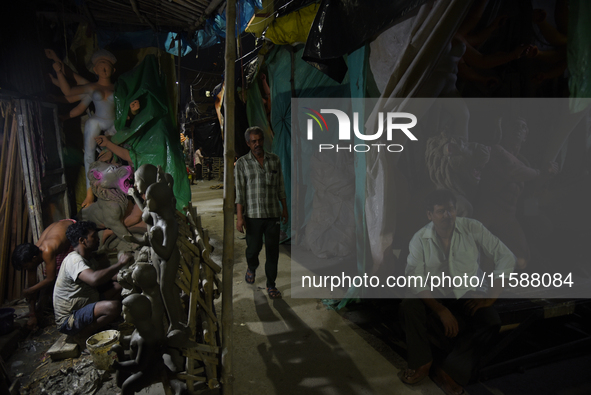 An artisan makes an idol of the Hindu Goddess Durga in Kumartuli, the potter's village in Kolkata, India, on September 20, 2024. The four-da...