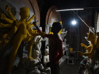 An artisan makes an idol of the Hindu Goddess Durga in Kumartuli, the potter's village in Kolkata, India, on September 20, 2024. The four-da...