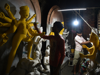 An artisan makes an idol of the Hindu Goddess Durga in Kumartuli, the potter's village in Kolkata, India, on September 20, 2024. The four-da...