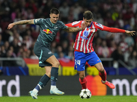 Benjamin Sesko centre-forward of RB Leipzig and Slovenia and Robin Le Normand centre-back of Atletico de Madrid and Spaincompete for the bal...