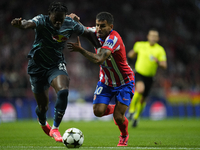 Angel Correa right winger of Atletico de Madrid and Argentina  and Castello Lukeba centre-back of RB Leipzig and France compete for the ball...