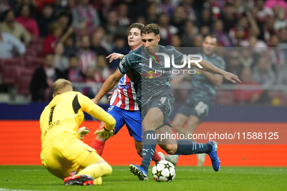 Julian Alvarez centre-forward of Atletico de Madrid and Argentina and Willi Orban centre-back of RB Leipzig and Hungary compete for the ball...