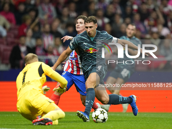 Julian Alvarez centre-forward of Atletico de Madrid and Argentina and Willi Orban centre-back of RB Leipzig and Hungary compete for the ball...