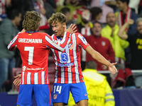 Antoine Griezmann second striker of Atletico de Madrid and France celebrates after scoring his sides first goal with Marcos Llorente during...