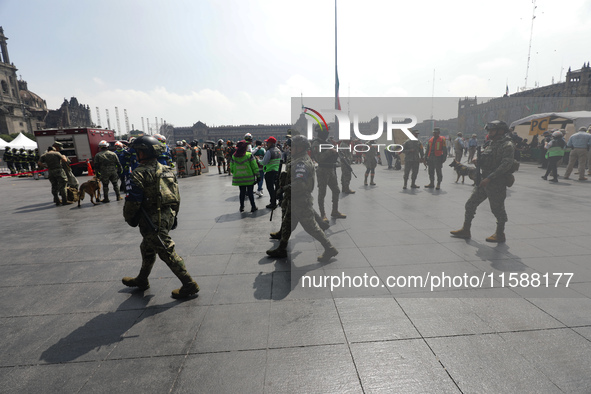 Rescuers and firefighters simulate an accident caused by the collapse of a building during the national earthquake drill with a magnitude of...