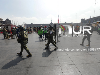 Rescuers and firefighters simulate an accident caused by the collapse of a building during the national earthquake drill with a magnitude of...