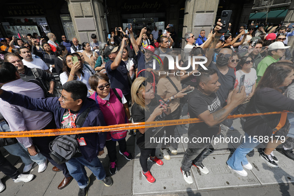 People demonstrate a simulation of rescuers and firefighters responding to an accident caused by the collapse of a building during the natio...