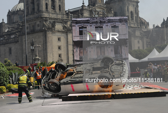 Rescuers and firefighters simulate an accident caused by the collapse of a building during the national earthquake drill with a magnitude of...