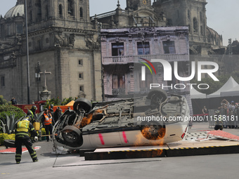 Rescuers and firefighters simulate an accident caused by the collapse of a building during the national earthquake drill with a magnitude of...