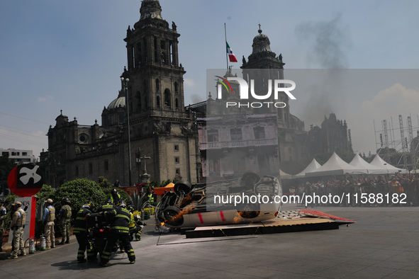 Rescuers and firefighters simulate an accident caused by the collapse of a building during the national earthquake drill with a magnitude of...