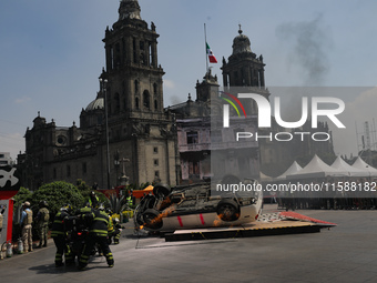 Rescuers and firefighters simulate an accident caused by the collapse of a building during the national earthquake drill with a magnitude of...