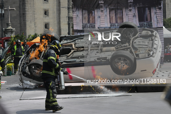 Rescuers and firefighters simulate an accident caused by the collapse of a building during the national earthquake drill with a magnitude of...