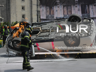 Rescuers and firefighters simulate an accident caused by the collapse of a building during the national earthquake drill with a magnitude of...