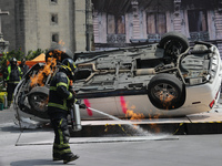 Rescuers and firefighters simulate an accident caused by the collapse of a building during the national earthquake drill with a magnitude of...