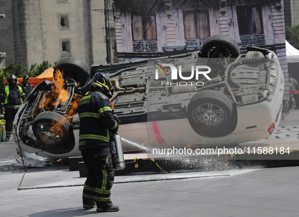 Rescuers and firefighters simulate an accident caused by the collapse of a building during the national earthquake drill with a magnitude of...