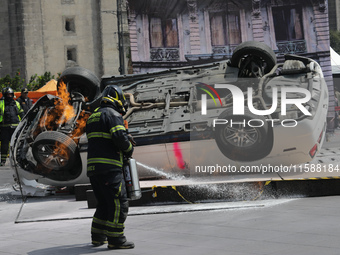 Rescuers and firefighters simulate an accident caused by the collapse of a building during the national earthquake drill with a magnitude of...