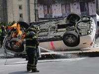 Rescuers and firefighters simulate an accident caused by the collapse of a building during the national earthquake drill with a magnitude of...