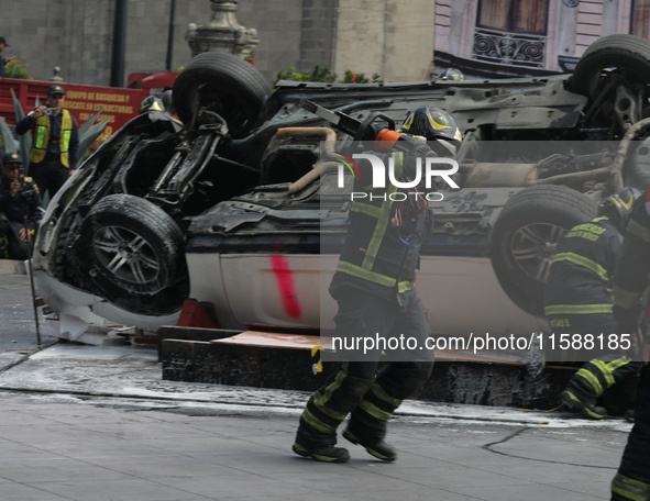 Rescuers and firefighters simulate an accident caused by the collapse of a building during the national earthquake drill with a magnitude of...