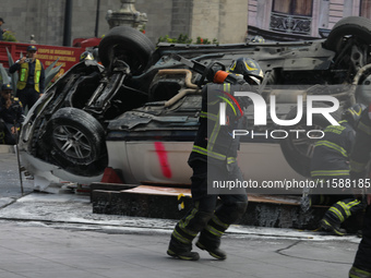 Rescuers and firefighters simulate an accident caused by the collapse of a building during the national earthquake drill with a magnitude of...