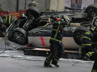 Rescuers and firefighters simulate an accident caused by the collapse of a building during the national earthquake drill with a magnitude of...