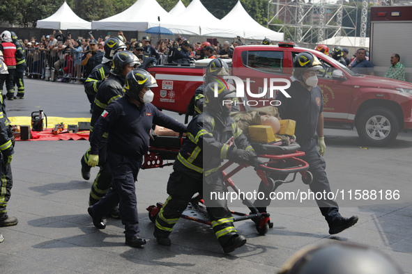 Rescuers and firefighters simulate an accident caused by the collapse of a building during the national earthquake drill with a magnitude of...