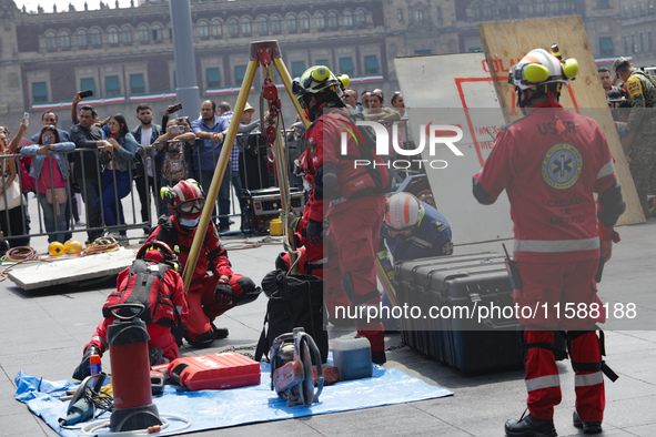 Rescuers and firefighters simulate an accident caused by the collapse of a building during the national earthquake drill with a magnitude of...