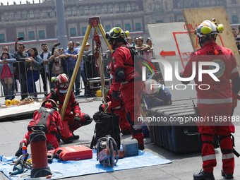 Rescuers and firefighters simulate an accident caused by the collapse of a building during the national earthquake drill with a magnitude of...