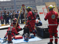 Rescuers and firefighters simulate an accident caused by the collapse of a building during the national earthquake drill with a magnitude of...