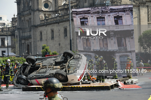 Rescuers and firefighters simulate an accident caused by the collapse of a building during the national earthquake drill with a magnitude of...