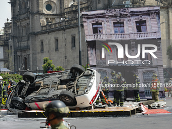 Rescuers and firefighters simulate an accident caused by the collapse of a building during the national earthquake drill with a magnitude of...