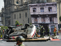 Rescuers and firefighters simulate an accident caused by the collapse of a building during the national earthquake drill with a magnitude of...