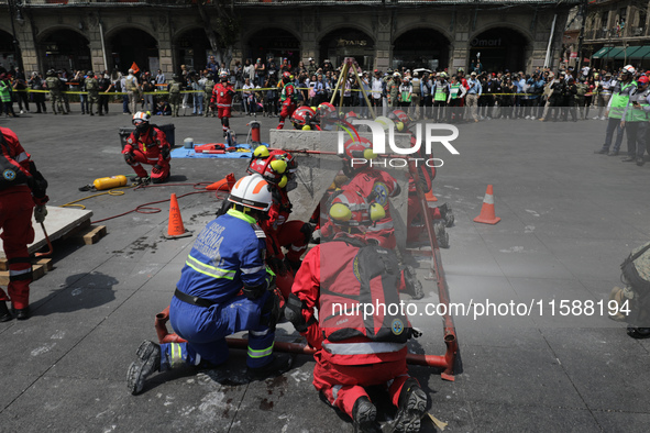 Rescuers and firefighters simulate an accident caused by the collapse of a building during the national earthquake drill with a magnitude of...