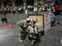 Rescuers and firefighters simulate an accident caused by the collapse of a building during the national earthquake drill with a magnitude of...