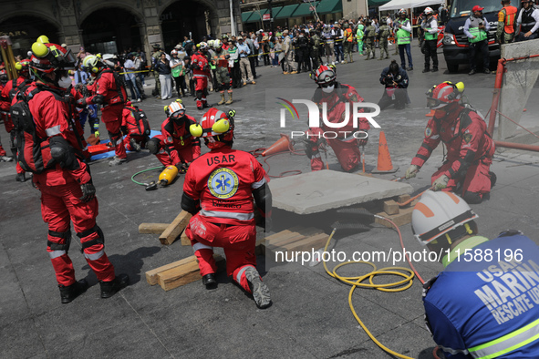 Rescuers and firefighters simulate an accident caused by the collapse of a building during the national earthquake drill with a magnitude of...