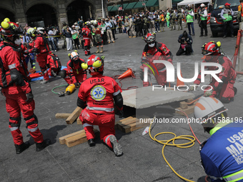 Rescuers and firefighters simulate an accident caused by the collapse of a building during the national earthquake drill with a magnitude of...