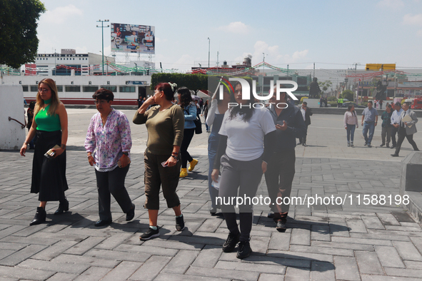 Mexican citizens take part in the 2024 National drill for a hypothetical earthquake of magnitude 7.5 on the Richter scale with an epicenter...