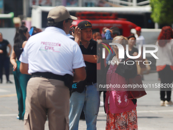 Civil protection workers take part in the 2024 National drill of a hypothetical earthquake of magnitude 7.5 on the Richter seismological sca...