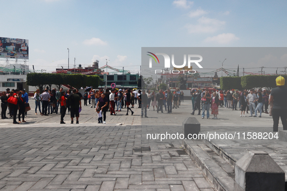 Mexican citizens take part in the 2024 National drill for a hypothetical earthquake of magnitude 7.5 on the Richter scale with an epicenter...