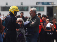 Members of the Fire Department take part in the 2024 national drill of a hypothetical earthquake of magnitude 7.5 on the Richter scale with...