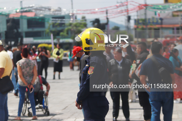 Members of the Fire Department take part in the 2024 national drill of a hypothetical earthquake of magnitude 7.5 on the Richter scale with...