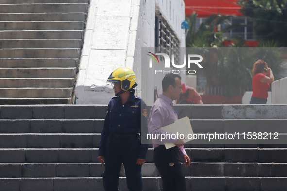 Members of the Fire Department take part in the 2024 national drill of a hypothetical earthquake of magnitude 7.5 on the Richter scale with...