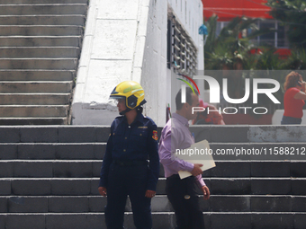 Members of the Fire Department take part in the 2024 national drill of a hypothetical earthquake of magnitude 7.5 on the Richter scale with...