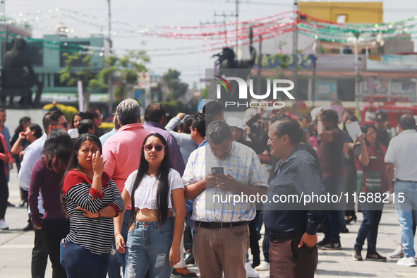 Mexican citizens take part in the 2024 National drill for a hypothetical earthquake of magnitude 7.5 on the Richter scale with an epicenter...