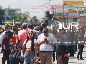 Mexican citizens take part in the 2024 National drill for a hypothetical earthquake of magnitude 7.5 on the Richter scale with an epicenter...