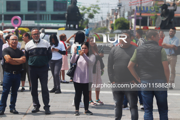 Mexican citizens take part in the 2024 National drill for a hypothetical earthquake of magnitude 7.5 on the Richter scale with an epicenter...