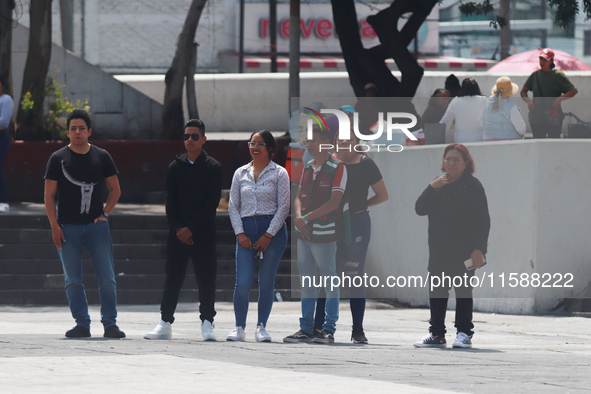 Mexican citizens take part in the 2024 National drill for a hypothetical earthquake of magnitude 7.5 on the Richter scale with an epicenter...