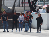 Mexican citizens take part in the 2024 National drill for a hypothetical earthquake of magnitude 7.5 on the Richter scale with an epicenter...