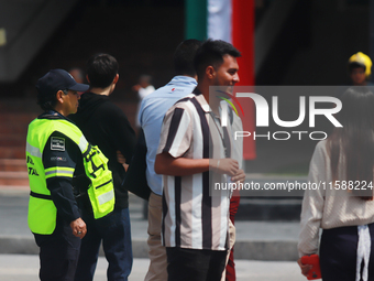 Mexican citizens take part in the 2024 National drill for a hypothetical earthquake of magnitude 7.5 on the Richter scale with an epicenter...