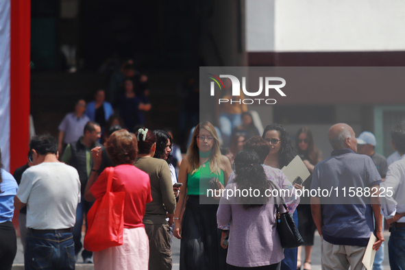 Mexican citizens take part in the 2024 National drill for a hypothetical earthquake of magnitude 7.5 on the Richter scale with an epicenter...