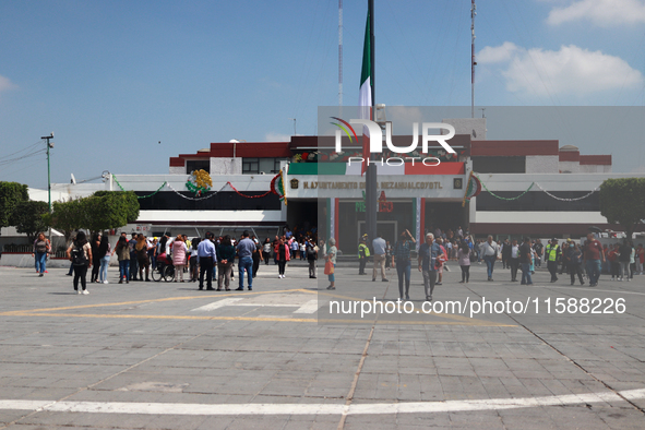 Mexican citizens take part in the 2024 National drill for a hypothetical earthquake of magnitude 7.5 on the Richter scale with an epicenter...